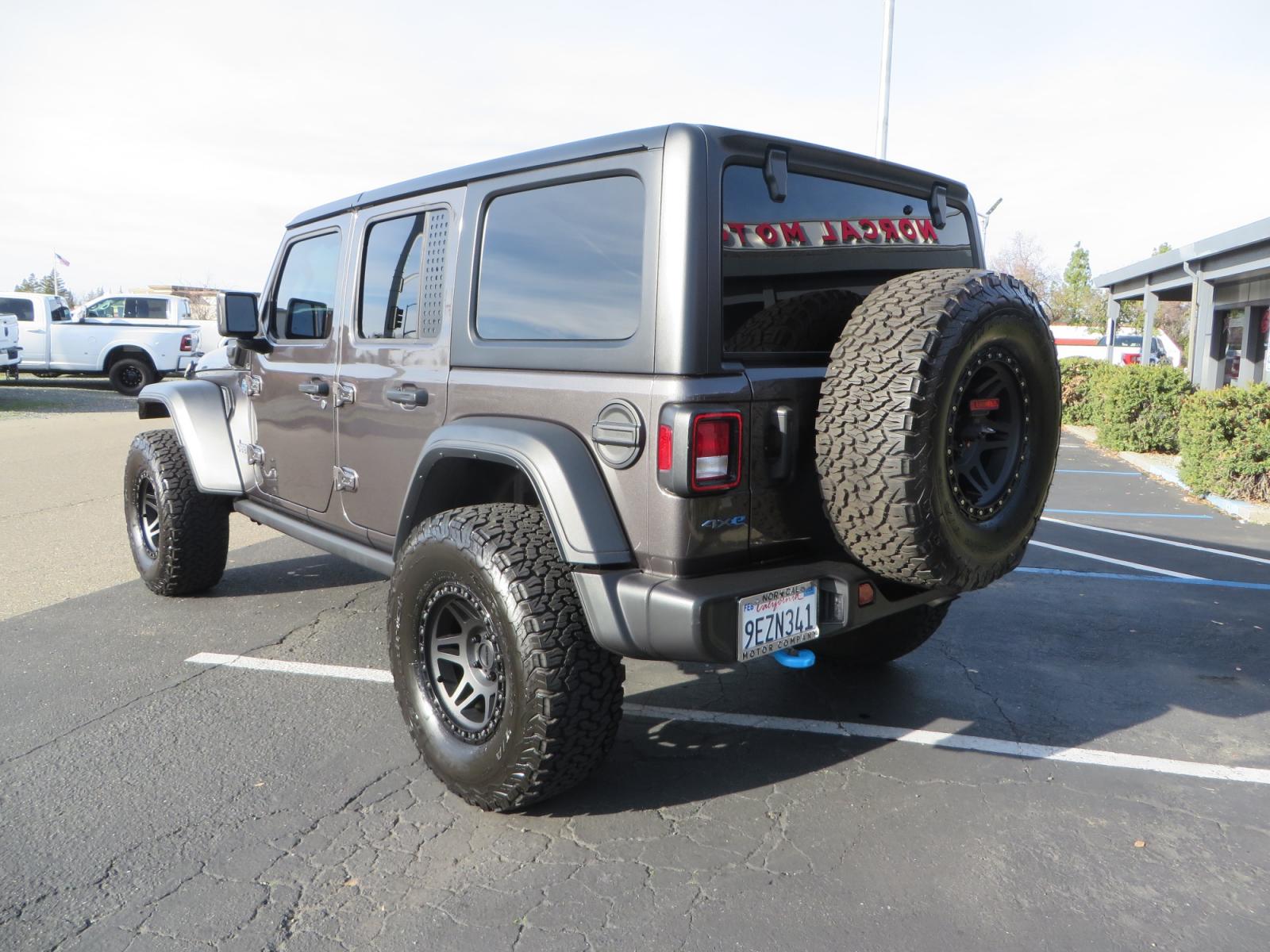 2023 CHARCOAL /black Jeep Wrangler Unlimited Willys 4XE (1C4JJXN68PW) with an 2.0L L4 DOHC 16V HYBRID engine, 8A transmission, located at 2630 Grass Valley Highway, Auburn, CA, 95603, (530) 508-5100, 38.937893, -121.095482 - 3" Zone Offroad lift kit, Fox Adventure series shocks, 17" Method Race wheels, 37" BFG KO2 tires, and a Teraflex spare tire carrier. - Photo #6